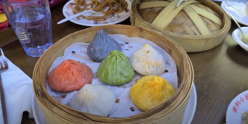 Image of vibrant dumplings at Nan Xiang Xiao Long Bao