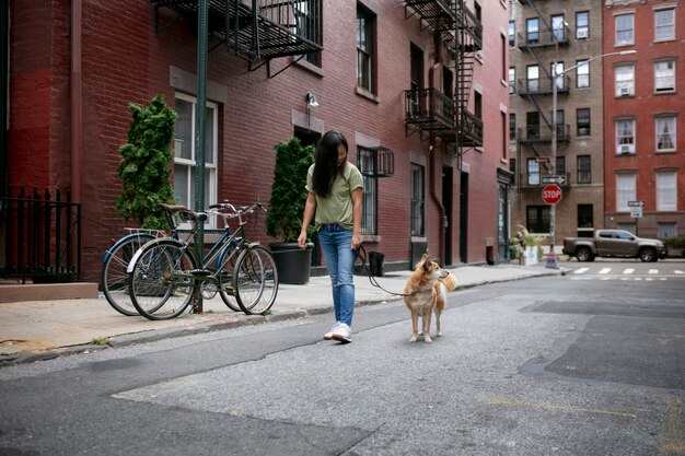 Woman walking her dog in the neighborhood